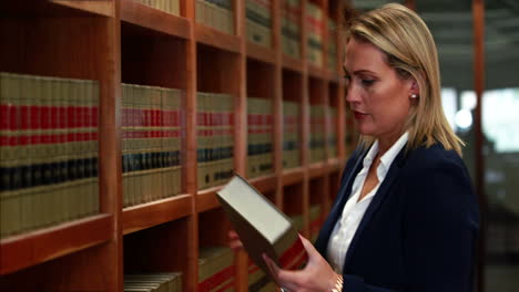 librarian picking book from the shelf