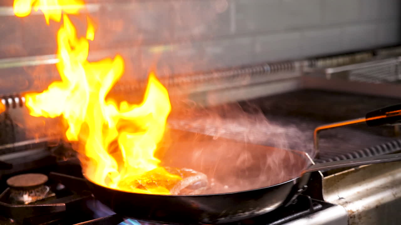Cooking with fire in a pan