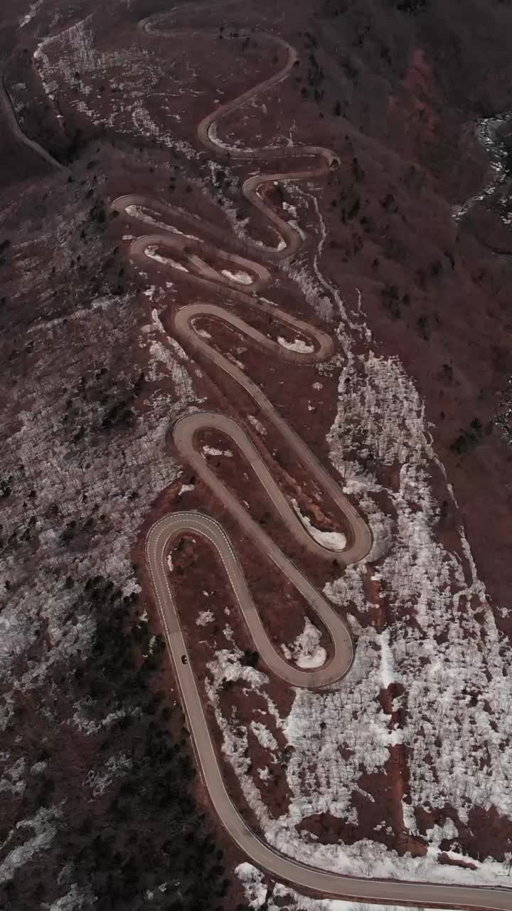 Vertical Aerial Fly Over Zigzag Road Through Arid Mount Zao Volcanic Landscape, Japan
