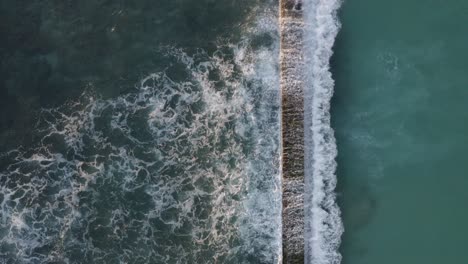 Unique-perspective-of-the-waves-crashing-against-the-breakwater-known-as-Waikiki-Walls-at-Waikiki-Beach