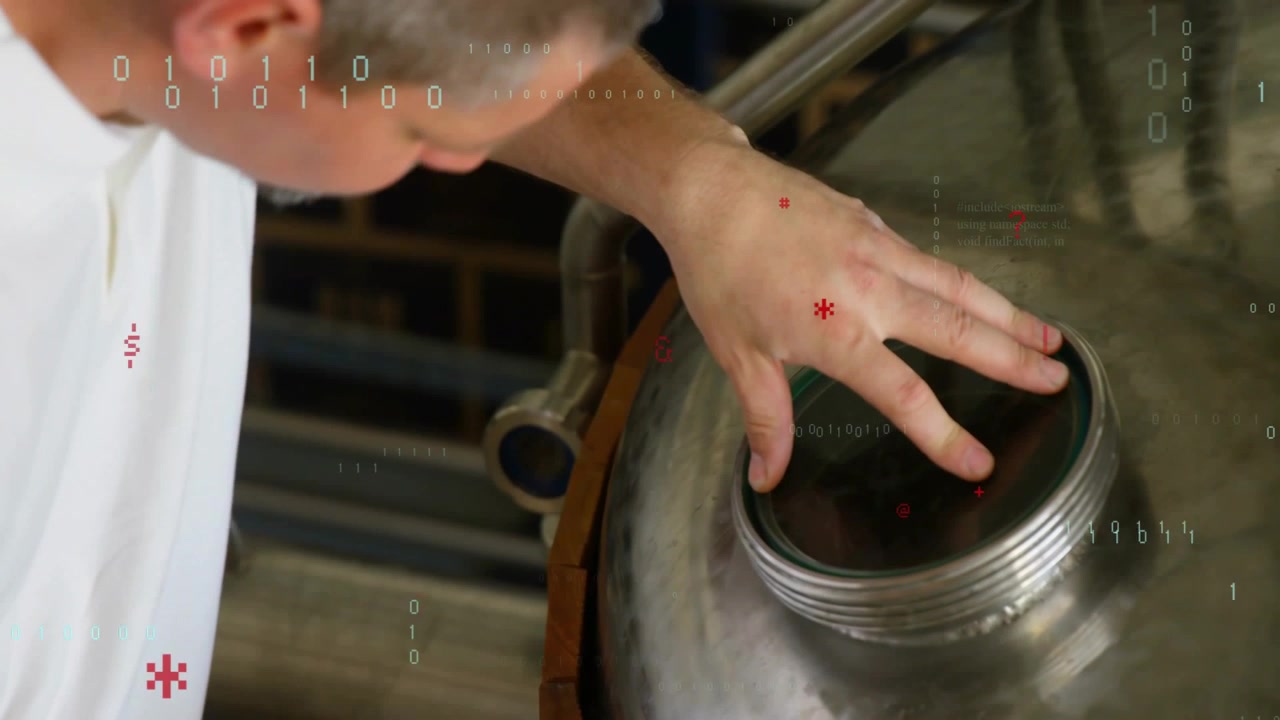 Approaching tech in shirt leaning into steel tank opening, checking lid, code appearing, copy space