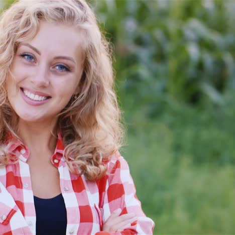 Portrait-of-a-young-woman-against-the-background-of-a-corn-field