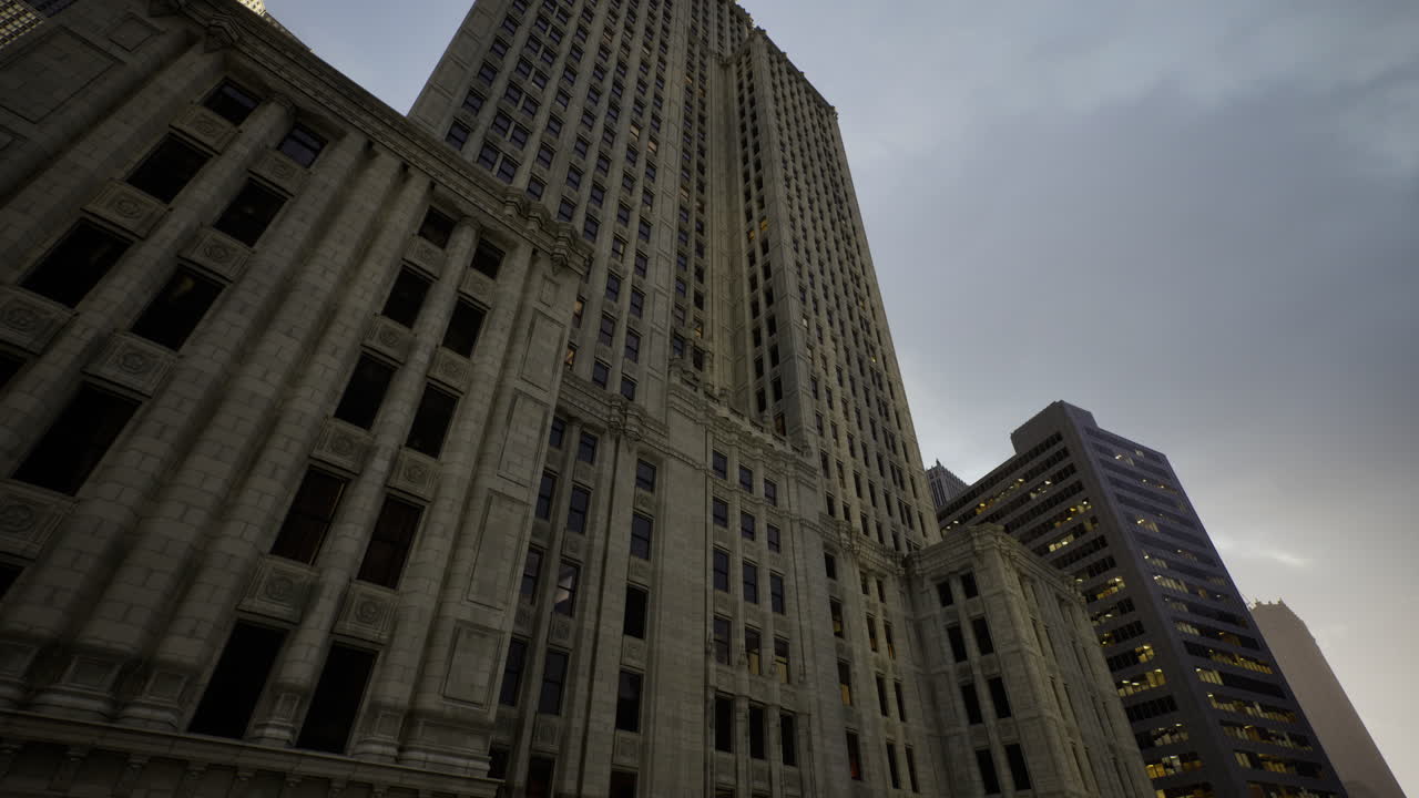 Tall historical building illuminated by evening light in downtown area