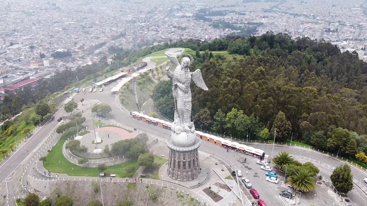 Aerial orbit of Panecillo Quito Capital City in the Andes mountains in Ecuador. Cityscape aerial orbit of famous statue in Ecuador