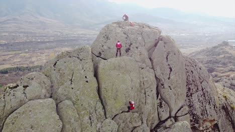 Emergency-team-climbing-a-rock-and-securing-the-terrain