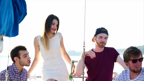 friends enjoying a day out on a yacht