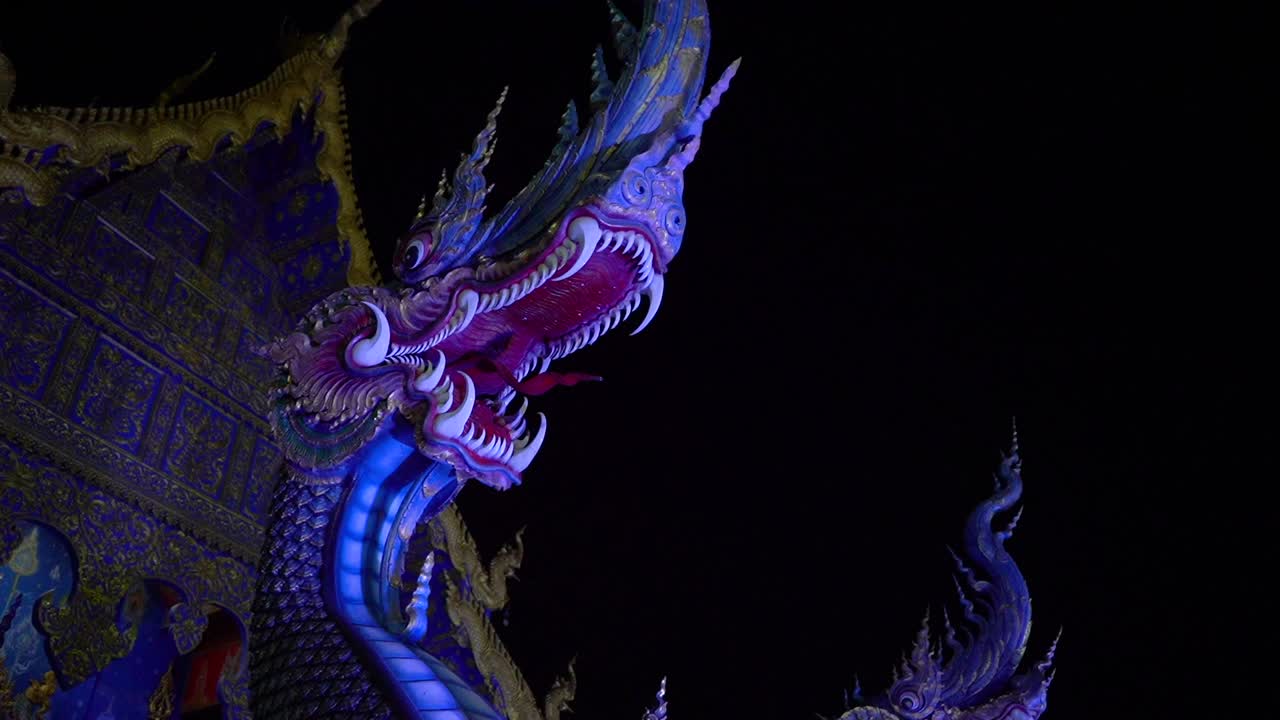 Dragon statue by night time at Wat Rong Sear Tean (Blue Temple). Chiang Rai, Thailand.