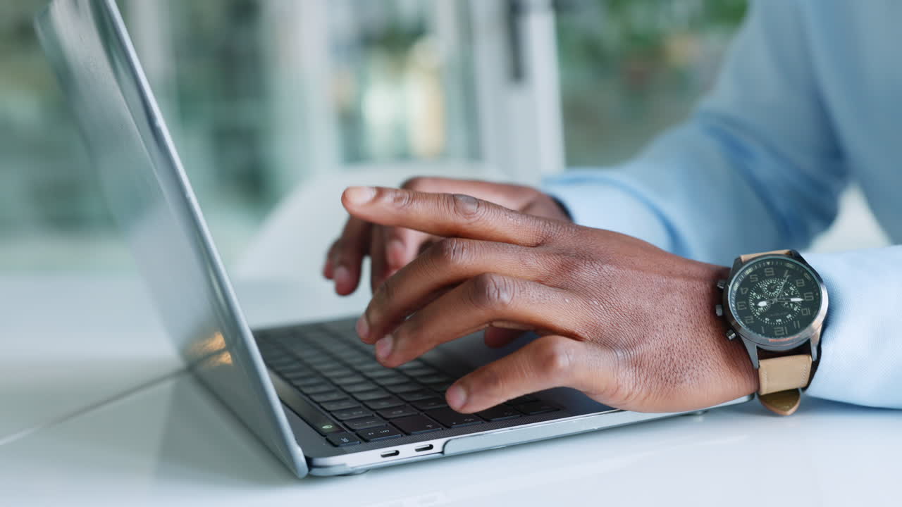 Business man hands typing on laptop keyboard