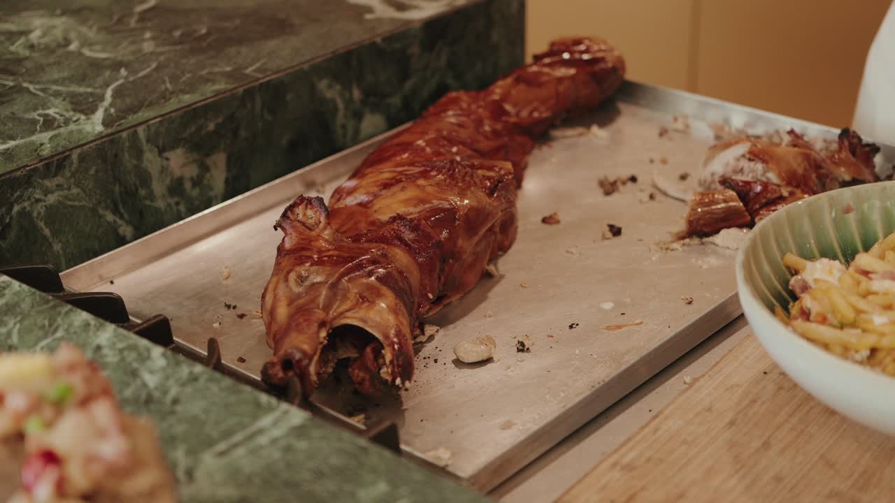 crispy whole roast pig on carving station ready for festive meal