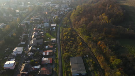 aerial view of a smaller city and its daily bustle on the streets during the golden hour