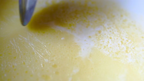 picking cream from a milk close up