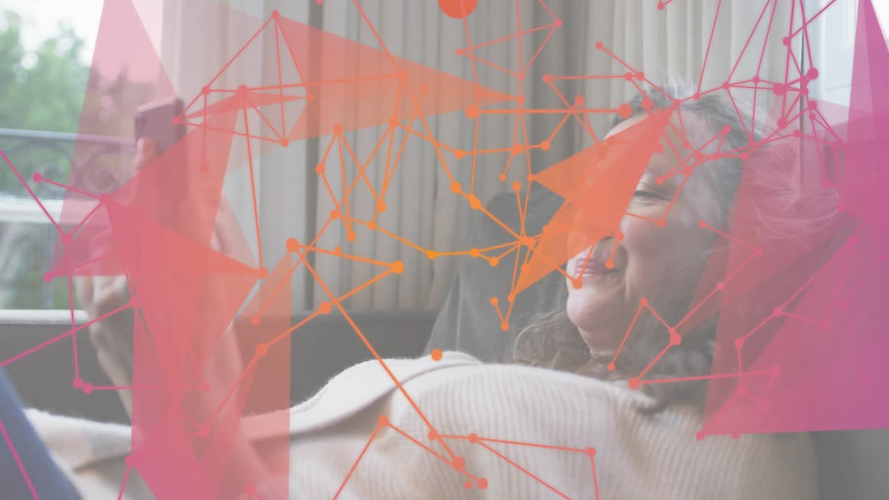 Mature woman reclining sofa hearing alert, scrolling smartphone browsing feed with tech graphic