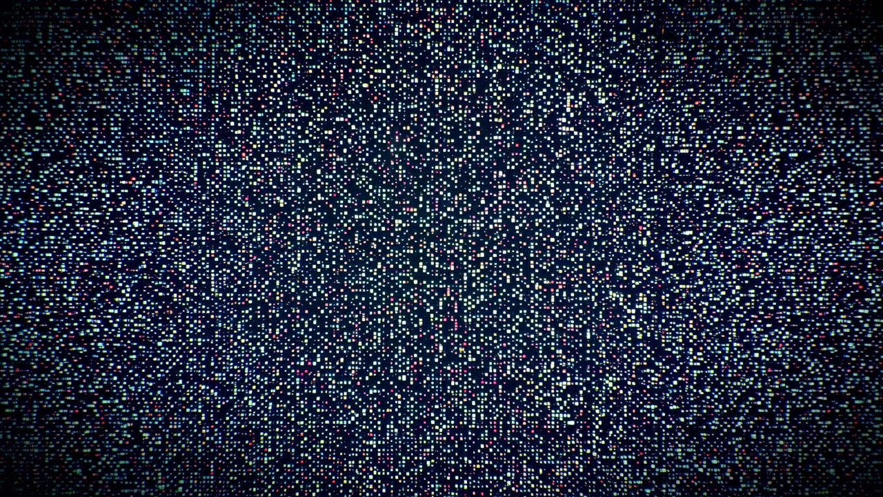 Vista ravvicinata di una matrice di pixel illuminata con piccoli quadrati e rettangoli su uno sfondo quasi nero, che mostra luci vibranti ciano, magenta, giallo, rosso, verde, blu in una scena tecnologica astratta.