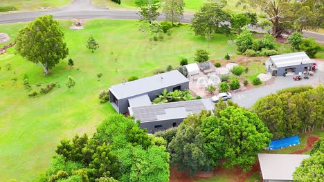 modern country home with solar panels and garden