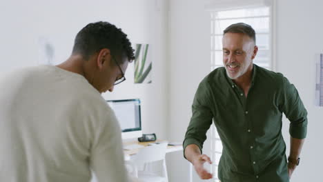 friendly mature bank manager shaking hands