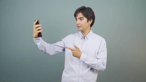 man making a video call on the phone.