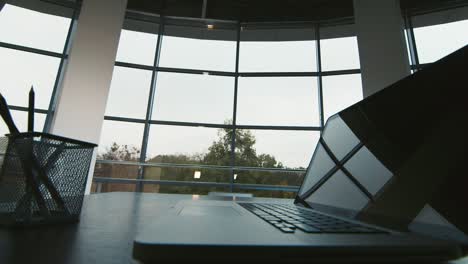 silhouettes of two businessmen meet in a spacious hall by the window 2