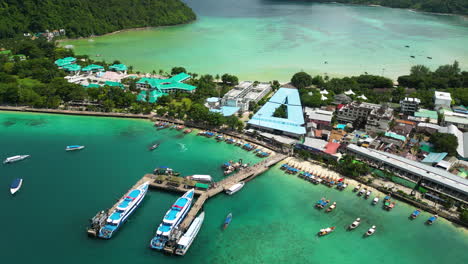 Cinematic-aerial-footage-flying-along-the-main-beach-of-Koh-Phi-Phi-Island-in-Thailand,-Asia,-Drone