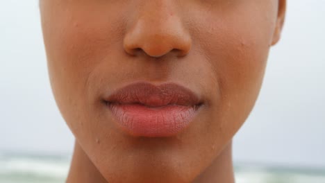 Close-up-of-young-black-woman-smiling-on-the-beach-4k