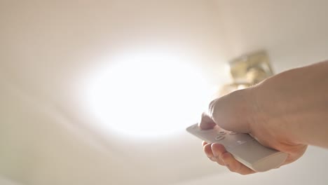 adjusting the brightness level of the ceiling light by remote control