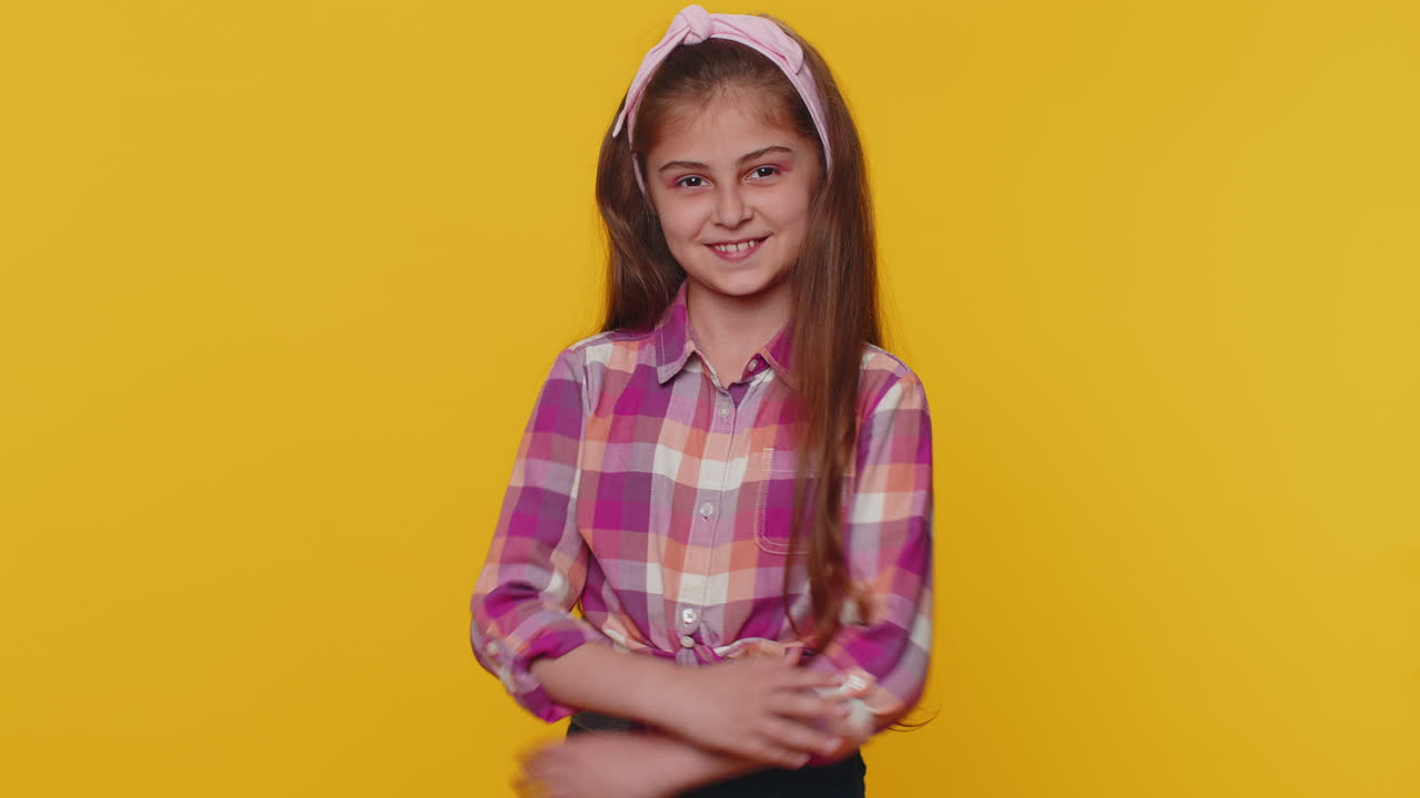 Cheerful lovely young preteen child girl kid smiling, looking at ...