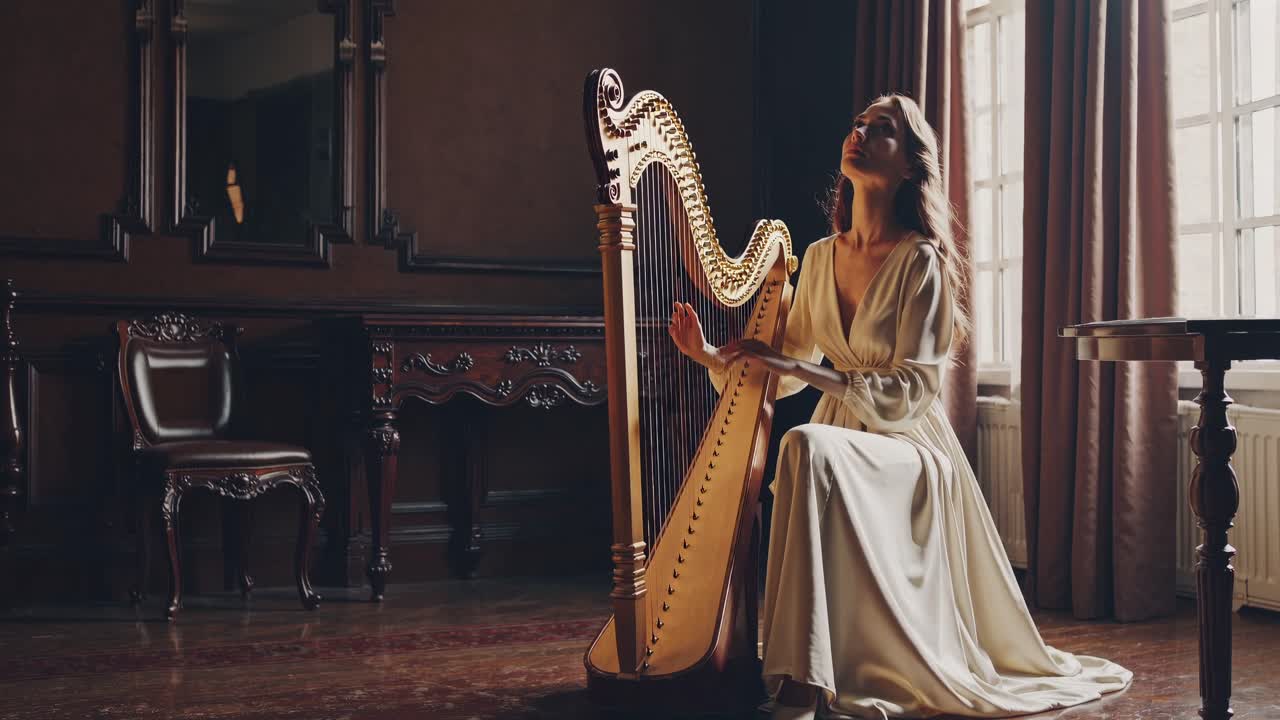 A serene video of a woman playing a harp in a vintage room