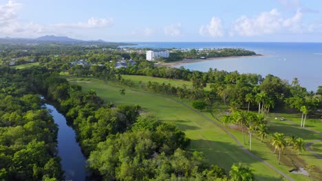 green and scenic landscape of desembocadura in rio munoz, puerto plata dominican republic - aerial shot