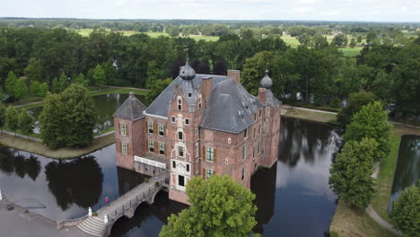 cannenburch castle, the netherlands: aerial view up to the beautiful castle and where you can see the moat that surrounds it