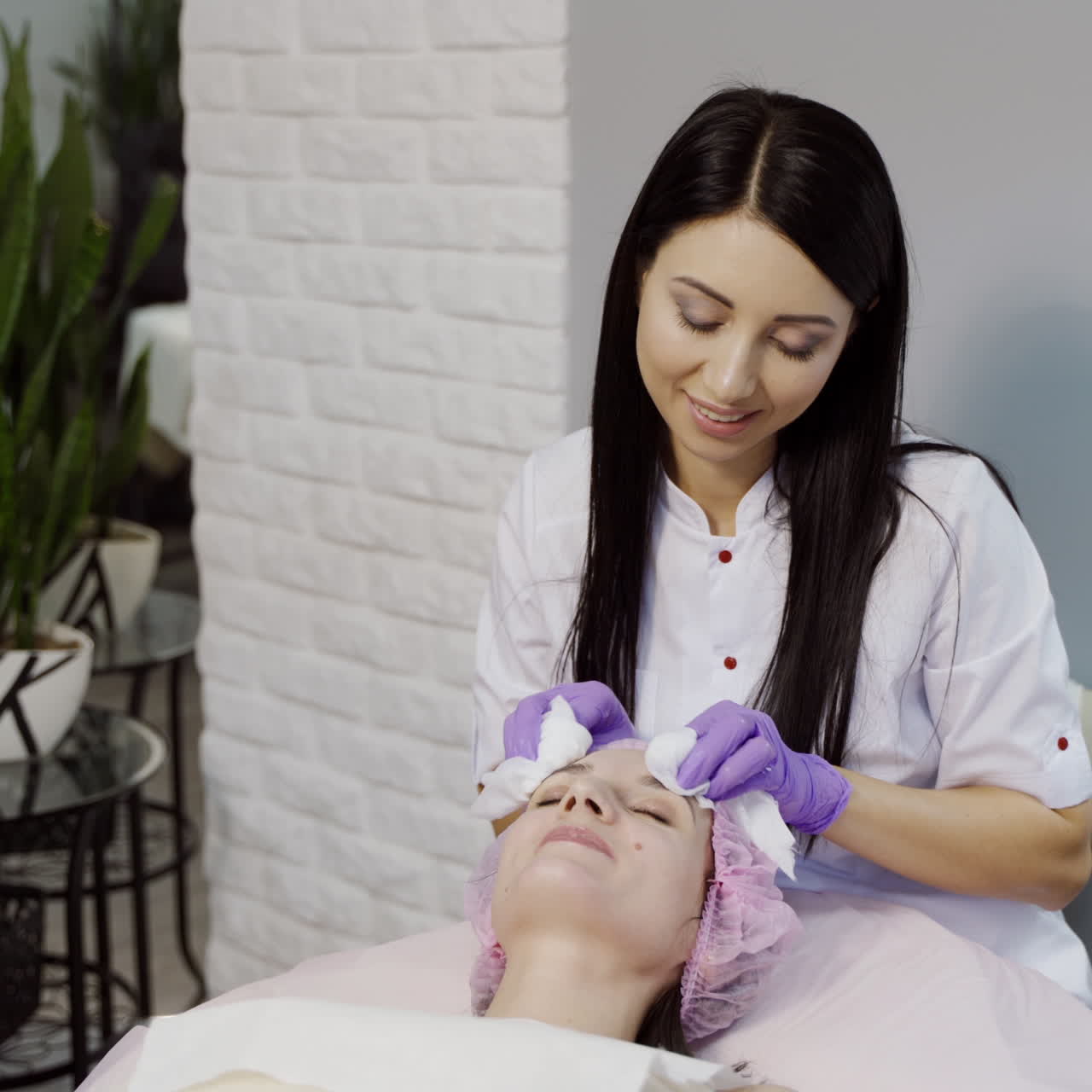 Skin care concept. Beautician is making a facial rejuvenation procedure for woman