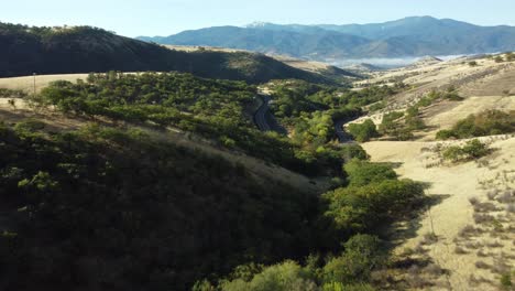 flying down a mountain valley and over dead indian memorial road in ashland, oregon, usa