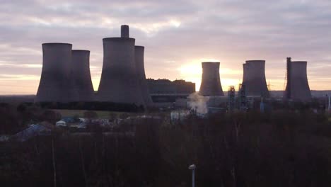 fiddlers ferry disused power station at sunrise, aerial view over treetops