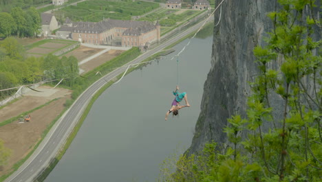 female athlete on slack line over cliff