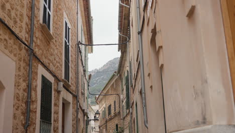 quiet street in soller, mallorca with traditional architecture