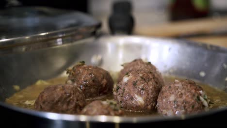 cooking down beyond meatballs in pan preparing ingredients to make vegan beyond meatballs with spaghetti and meat sauce