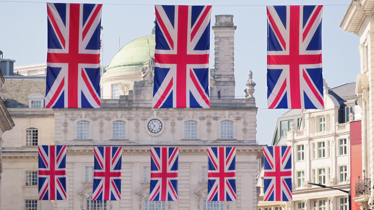 Multiple flags of the United Kingdom hanging proudly above Regent street in central London