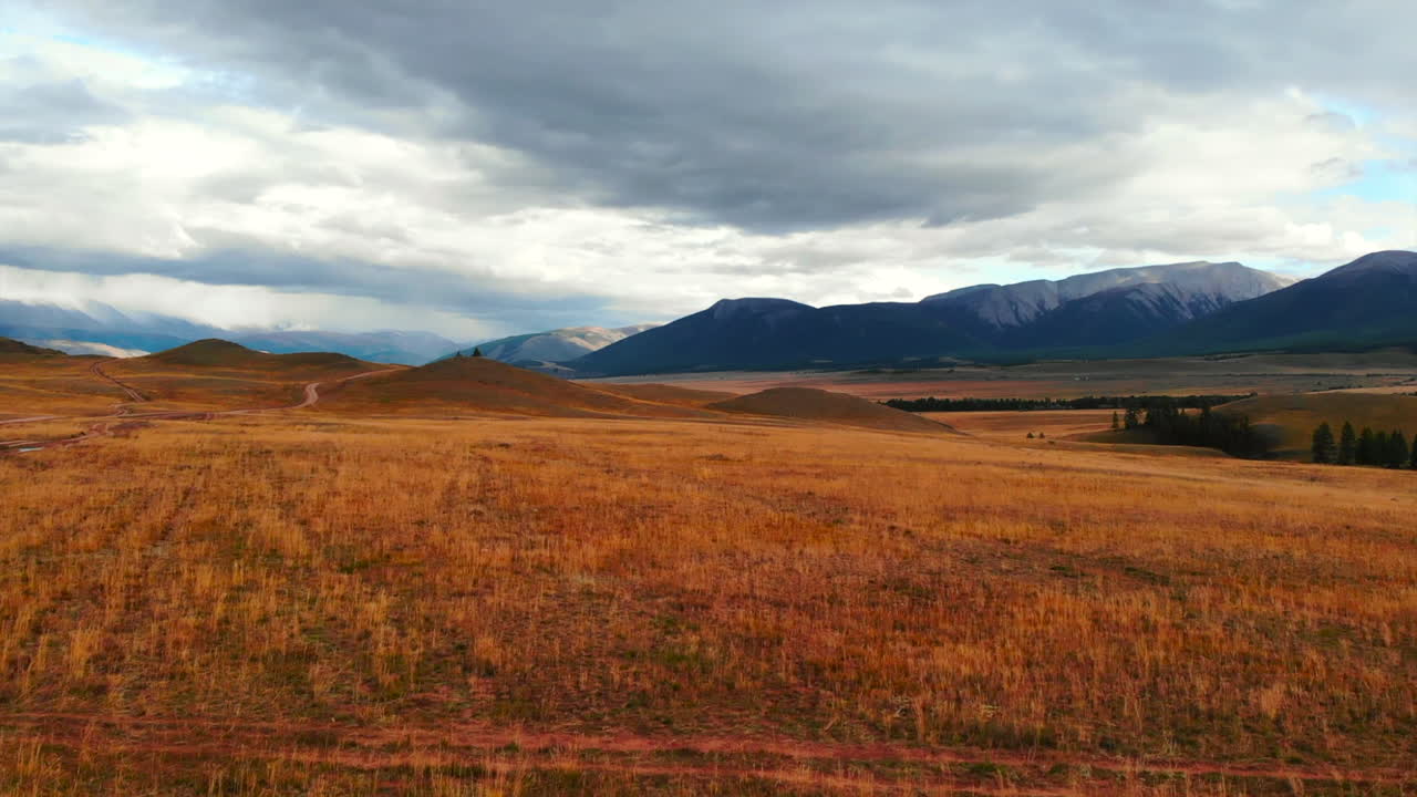 Scenic landscape with mountains and a dirt road