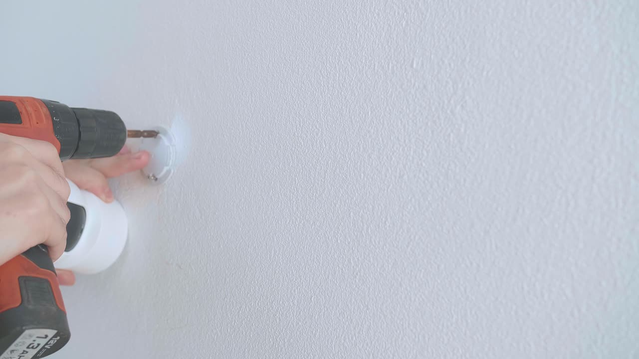 Man Hands Technician Worker Use Electric Drill And Install Cctv Camera On Wall For Security