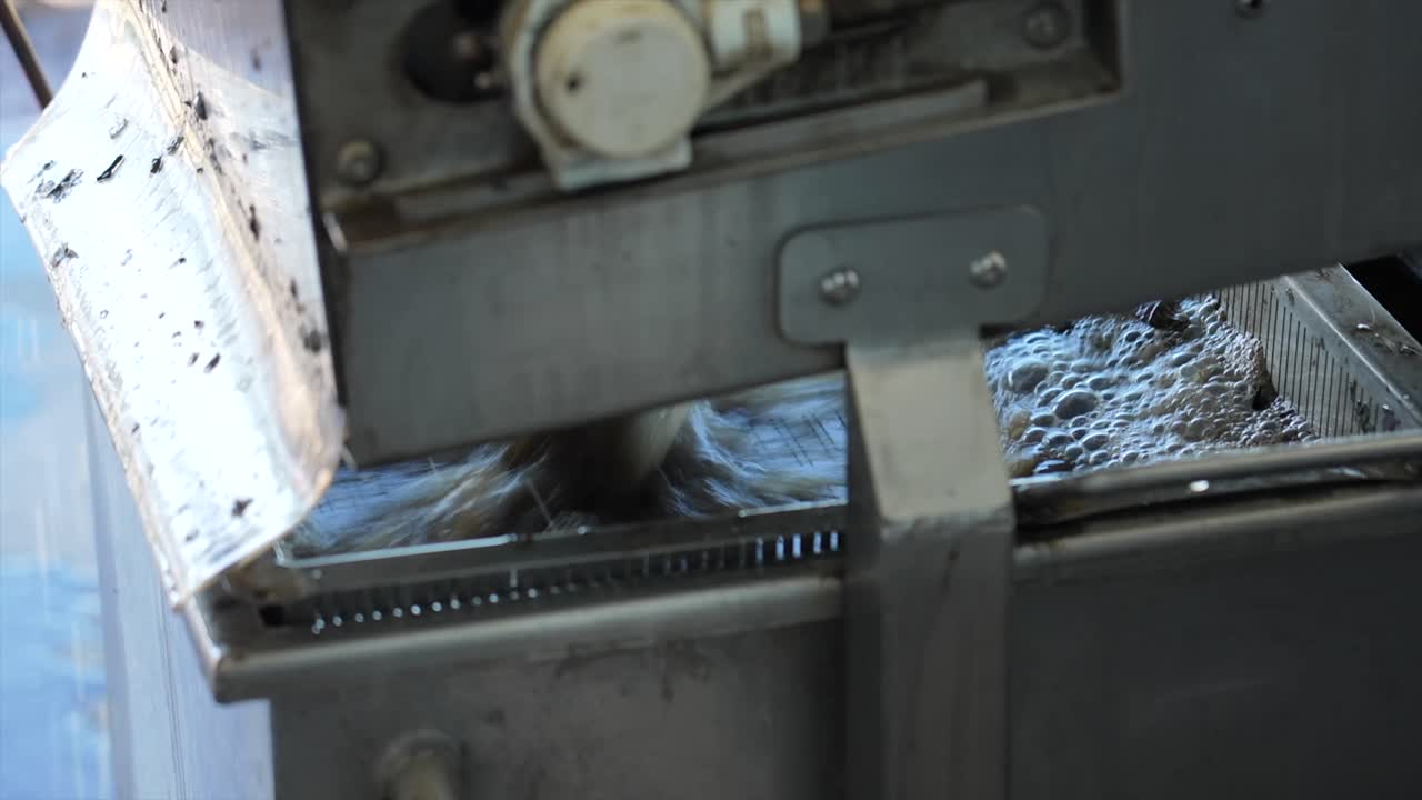 Oyster wash rinse discharge water flowing quickly at a commercial oyster farm in Australia