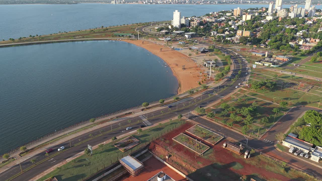 Aerial view of coastal promenade and calm El Brete bay waters, Misiones, Argentina