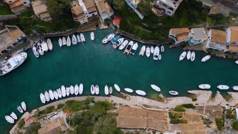 sailing ship marina with blue turquoise clear sea water and boats, palma de mallorca island