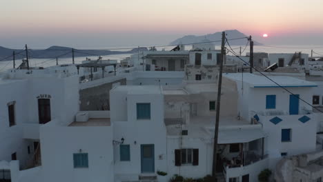 Greek-Village-with-Ocean-View-at-Sunset-Aerial
