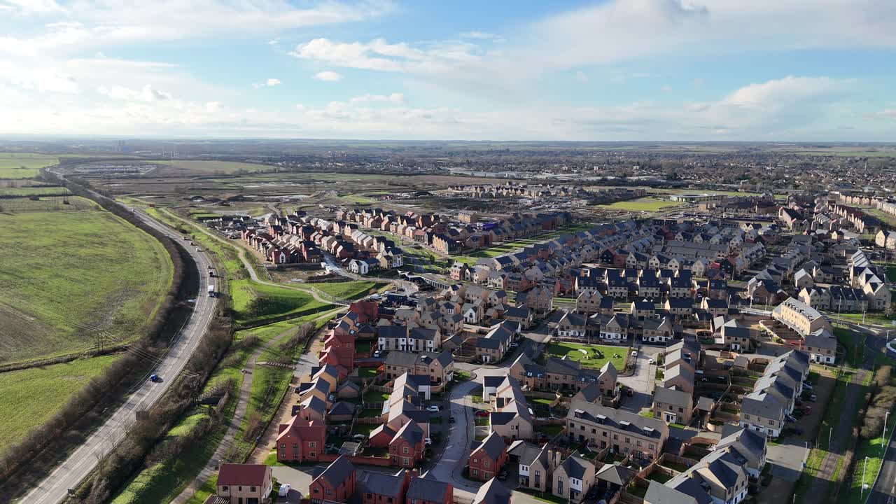 Ascending drone,aerial New build houses Wintringham St Neots UK