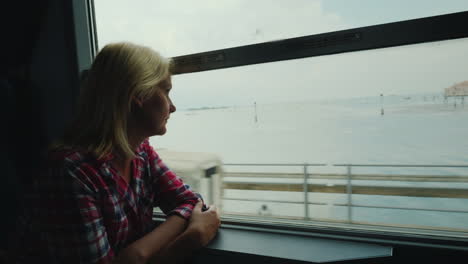 woman on train arriving at santa lucia station venice