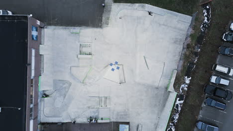 A-TOP-DOWN-aerial-drone-shot-of-a-skateboarder-skating-through-the-skatepark