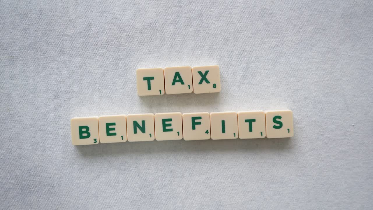Phrase "Tax Benefits" with green letters