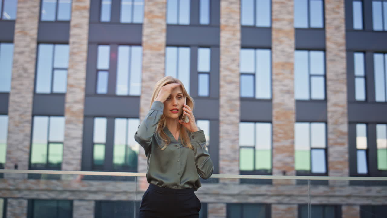 Nervous businesswoman arguing smartphone at downtown closeup. Mad woman call