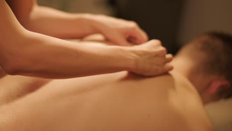 professional massage therapist performing relaxation massage