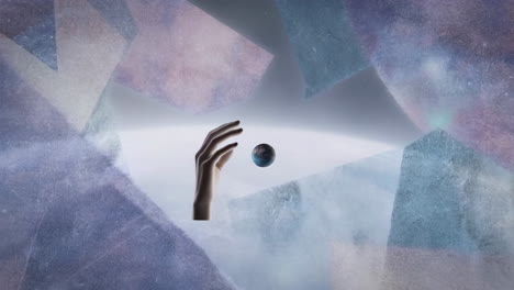 hand reaching for a planet in an abstract cosmic space