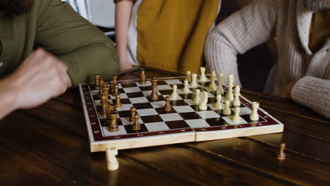 people playing a board game