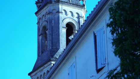 bell tower of a sandstone church in boulbon, france